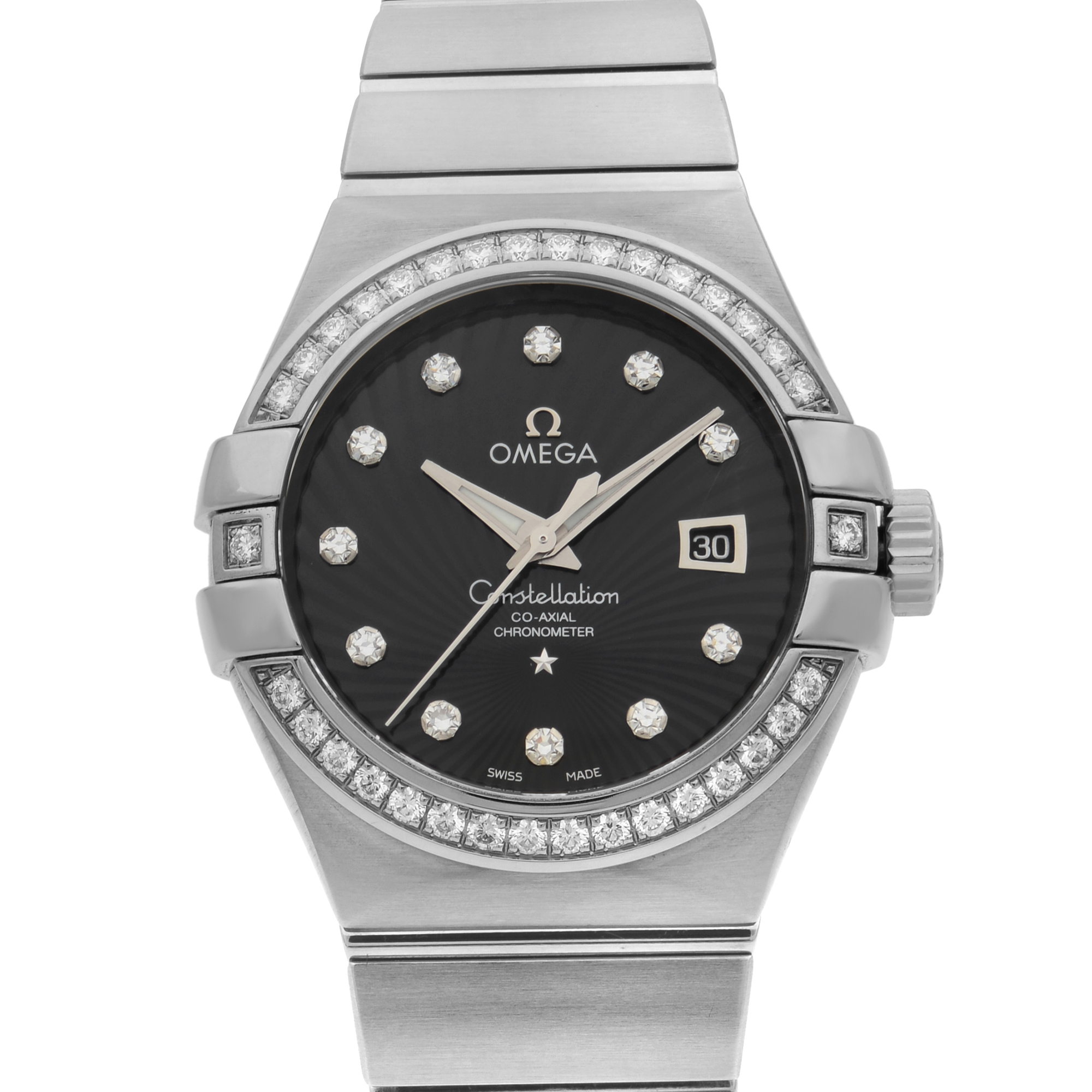 An image of an unworn OMEGA women's luxury wristwatch with a front close-up view of the watch face. The watch features a round shape with a black dial, surrounded by a bezel set with diamonds. The indices on the dial are also diamonds. The case and band material are both made of white gold, giving the watch a sleek and elegant appearance. The OMEGA logo is positioned at the top center of the dial, and there is a date window at the 3 o'clock position. The image is taken from a frontal angle, focusing on the watch face with a clear and close perspective.
