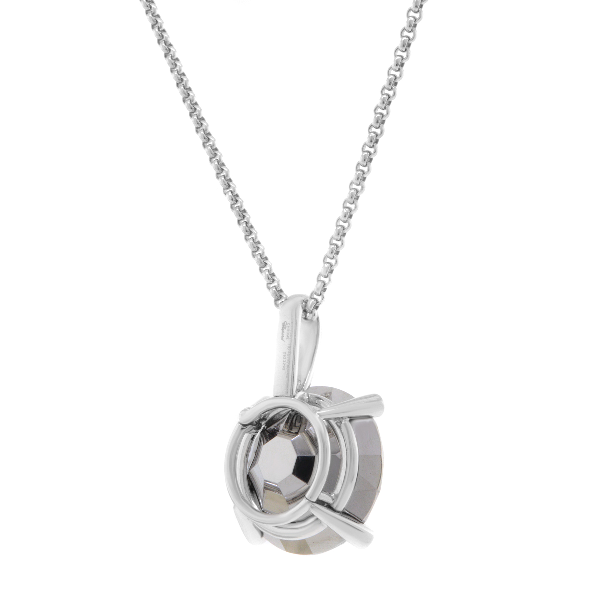 An image of a Chopard women's necklace from the back featuring a central chrome stone gemstone encircled by a polished 18k white gold setting, accented with diamonds. The necklace is displayed from a front angle, with a close-up view emphasizing the intricate design and craftsmanship. The chain is visible, highlighting the elegant and luxurious appeal of the piece. Excellent pre-owned condition. 