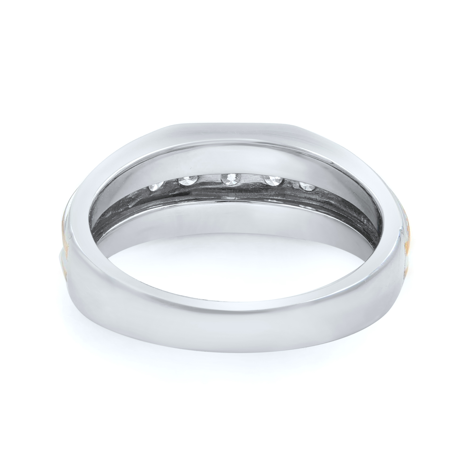 An image of a Rachel Koen brand men's wedding band with diamonds. The ring is positioned horizontally centered in the frame with a slight tilt, allowing a view of the band's exterior and interior. It appears to be a white gold band with a smooth, polished finish. Small diamonds are embedded within the upper inner part of the band, visible from this angle. The photograph is taken from a close distance, giving a clear view of the ring's design and the diamonds' placement, yet maintaining a soft focus on the metal's texture.