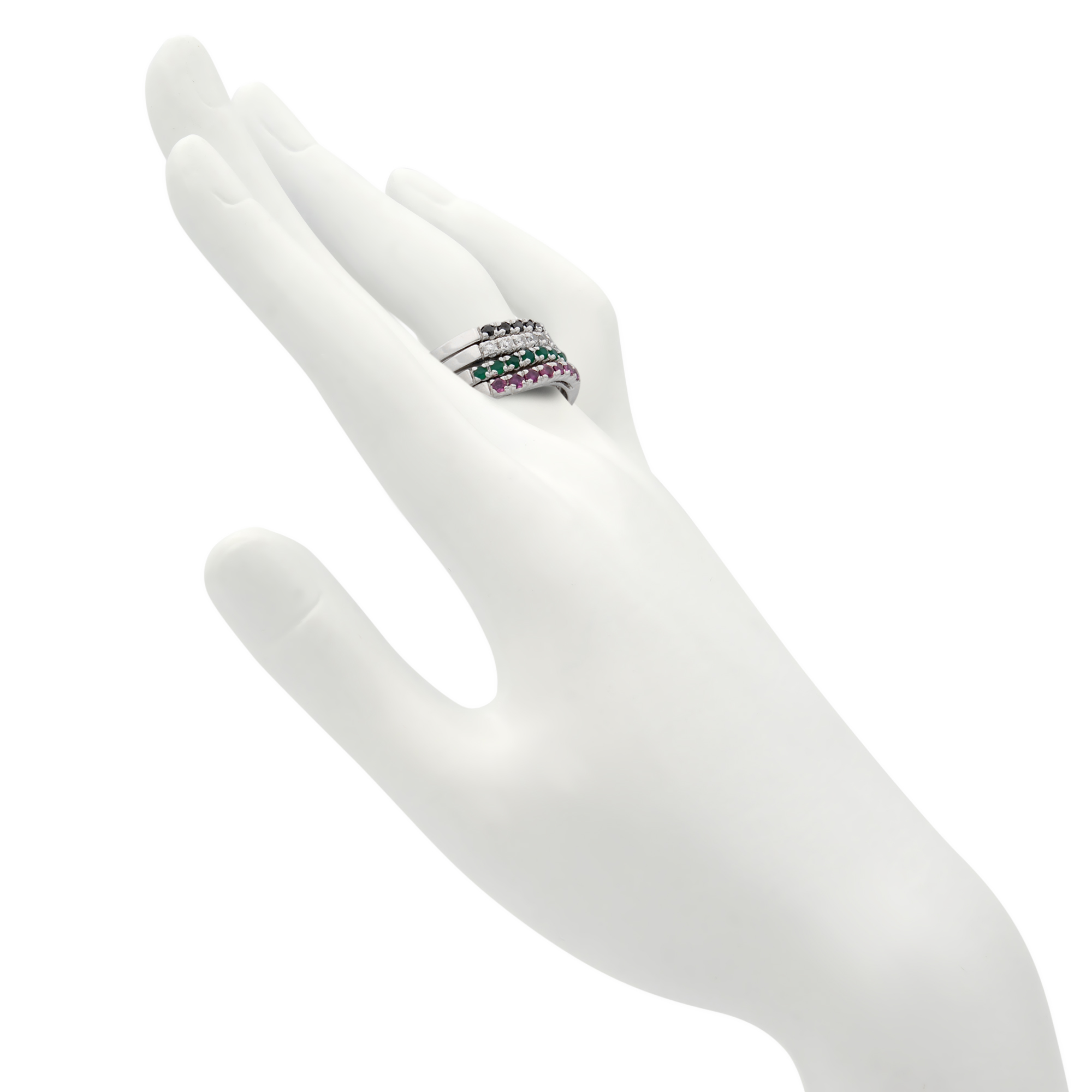 Side view of four bands ring studded with diamonds and gemstones on a manequin hand showing the perfect fit on the finger
