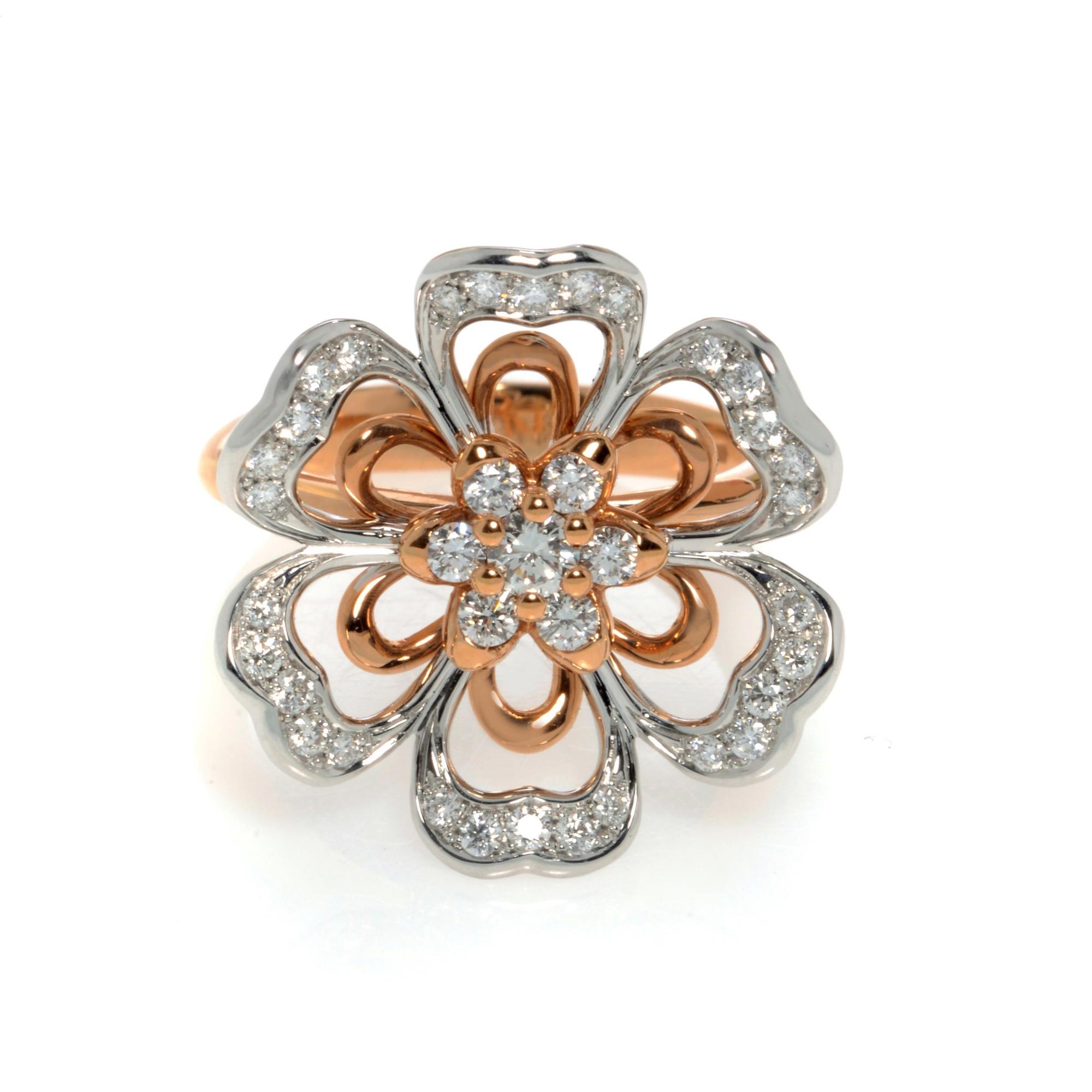 An image of a Luca Carati brand women's cocktail ring with diamonds, showcasing a close-up front view on a white background. The ring features a flower design with petals alternating in polished rose and white gold, embellished with pavé-set diamonds. The center of the flower is highlighted with larger, prong-set diamonds, giving a three-dimensional appearance. The angle of the photo captures the reflective surfaces and brilliance of the diamonds, emphasizing the intricate details and craftsmanship of the ring.