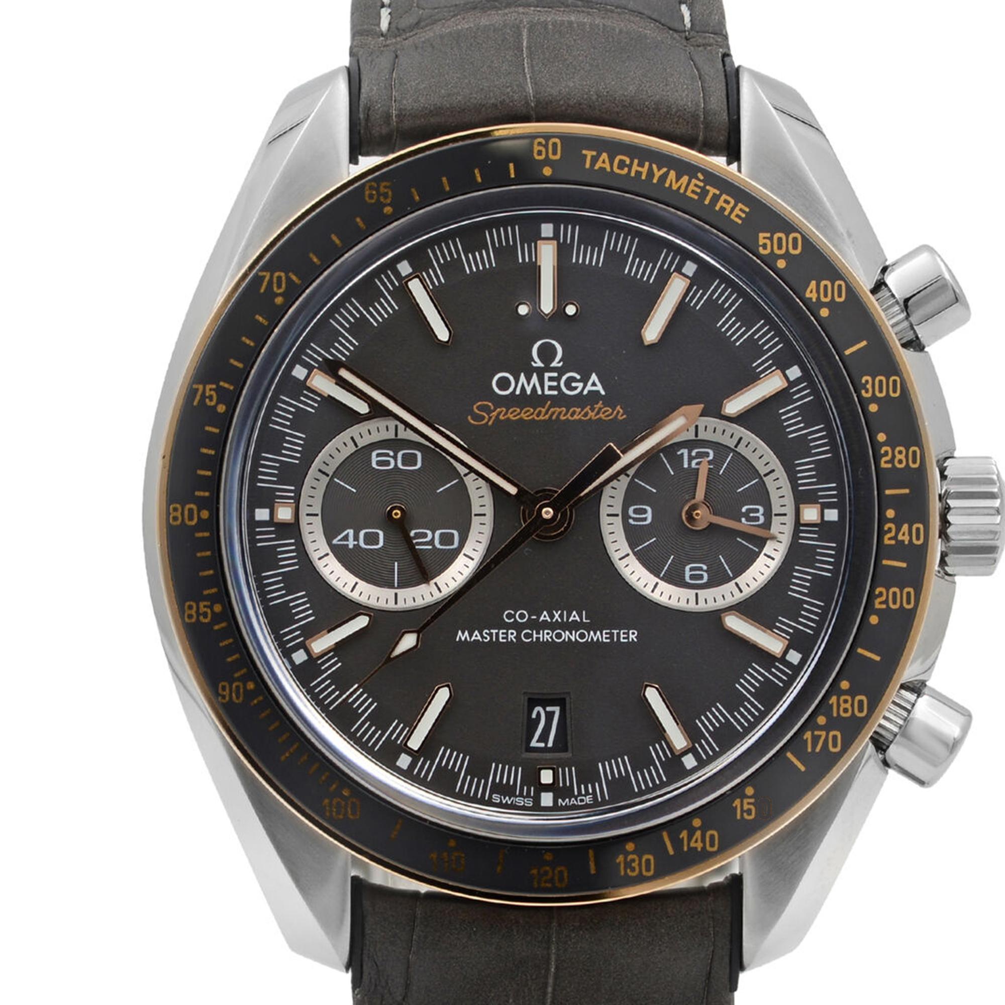 An image of a new Omega wristwatch with defects, designed for men. The watch is positioned upright, with the face captured from a front angle at a close distance. It features a chronograph and small seconds subdial on a grey dial, encased in a stainless steel body with a tachymeter scale on the bezel. The watch hands and markers are prominent, and the gray leather strap is visible at the top.