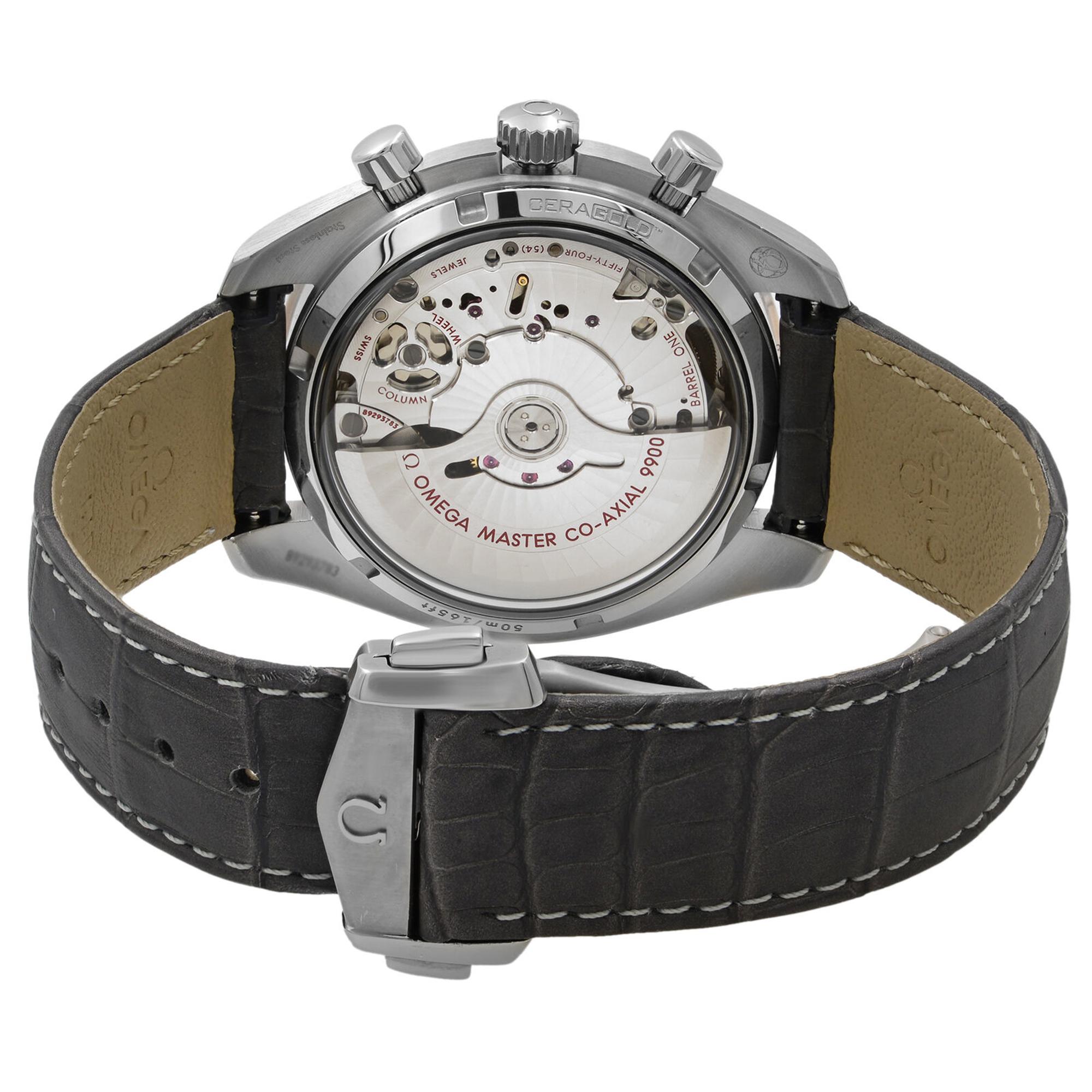 An image of a men's OMEGA wristwatch viewed from the back at a slight angle, showcasing its mechanical movement. The watch features a stainless steel case with visible chronograph controls and a grey leather strap. The focus is on the watch's intricate internal components and the "MASTER CO-AXIAL 9900" engraving. The image is taken from a close distance to highlight the watch's details.