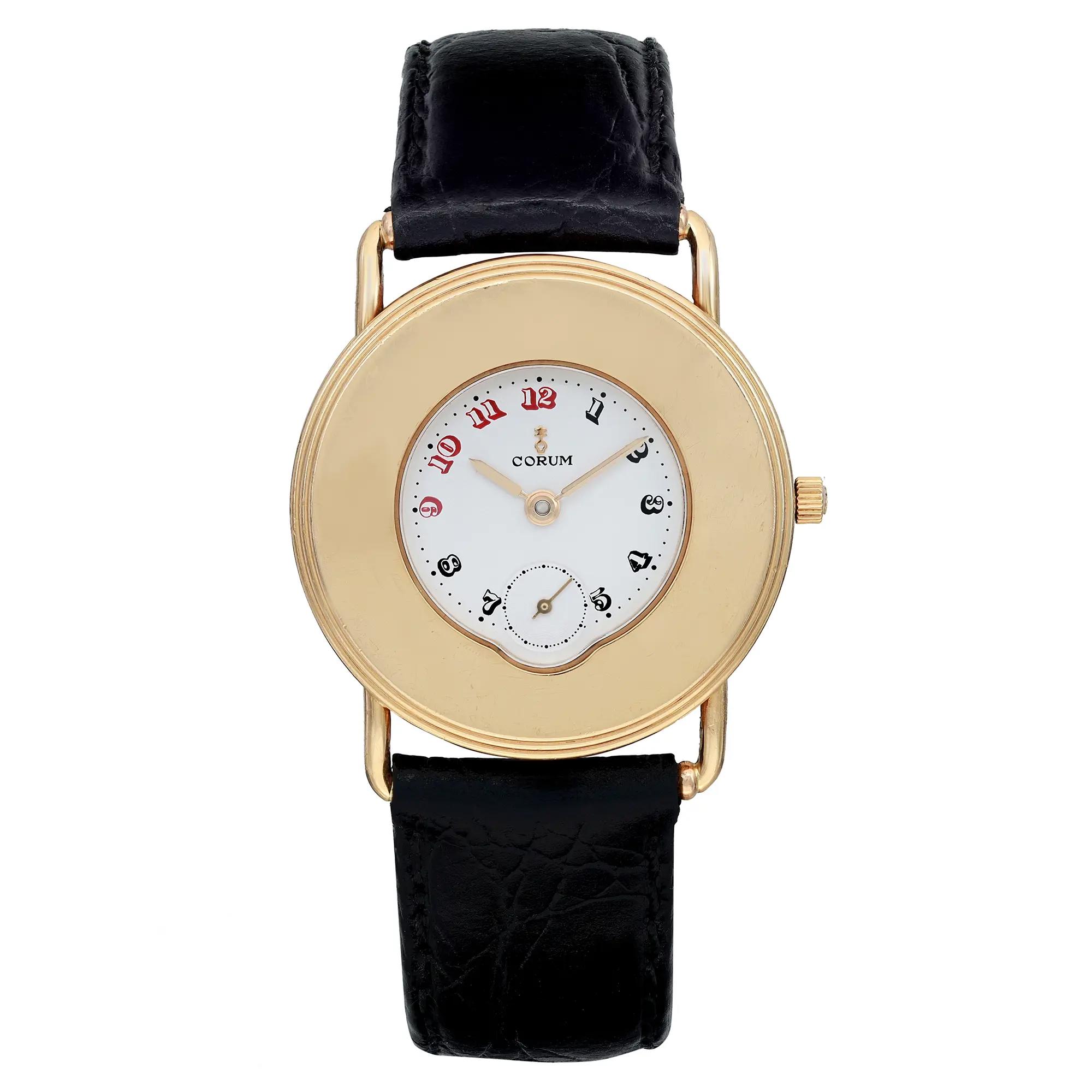 An image of a pre-owned wristwatch with a front full frontal view. The watch features a round gold case and a white dial with red and black Arabic numerals. It has a simple black leather strap. The crown is positioned on the right side of the case.