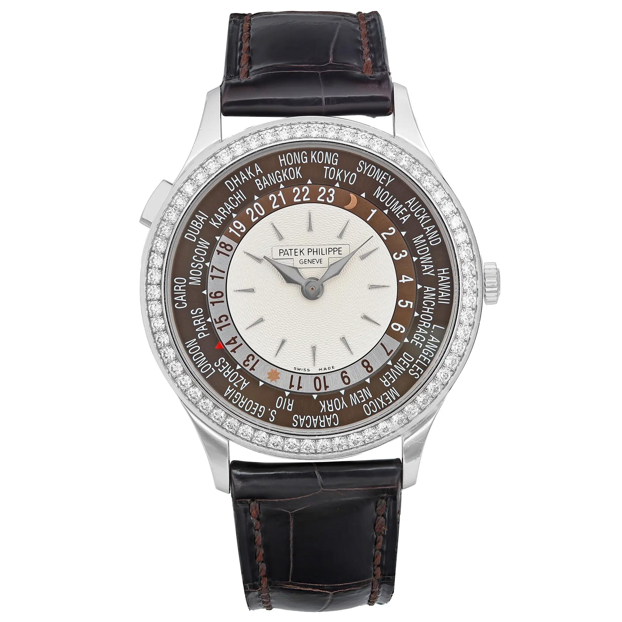 An image of a wristwatch in a front full frontal view. The watch features a round, detailed dial with city names and a 24-hour display, surrounded by a diamond-set bezel. It has a dark leather strap and is in pre-owned condition. The image is taken from a close distance, showcasing intricate details and craftsmanship.