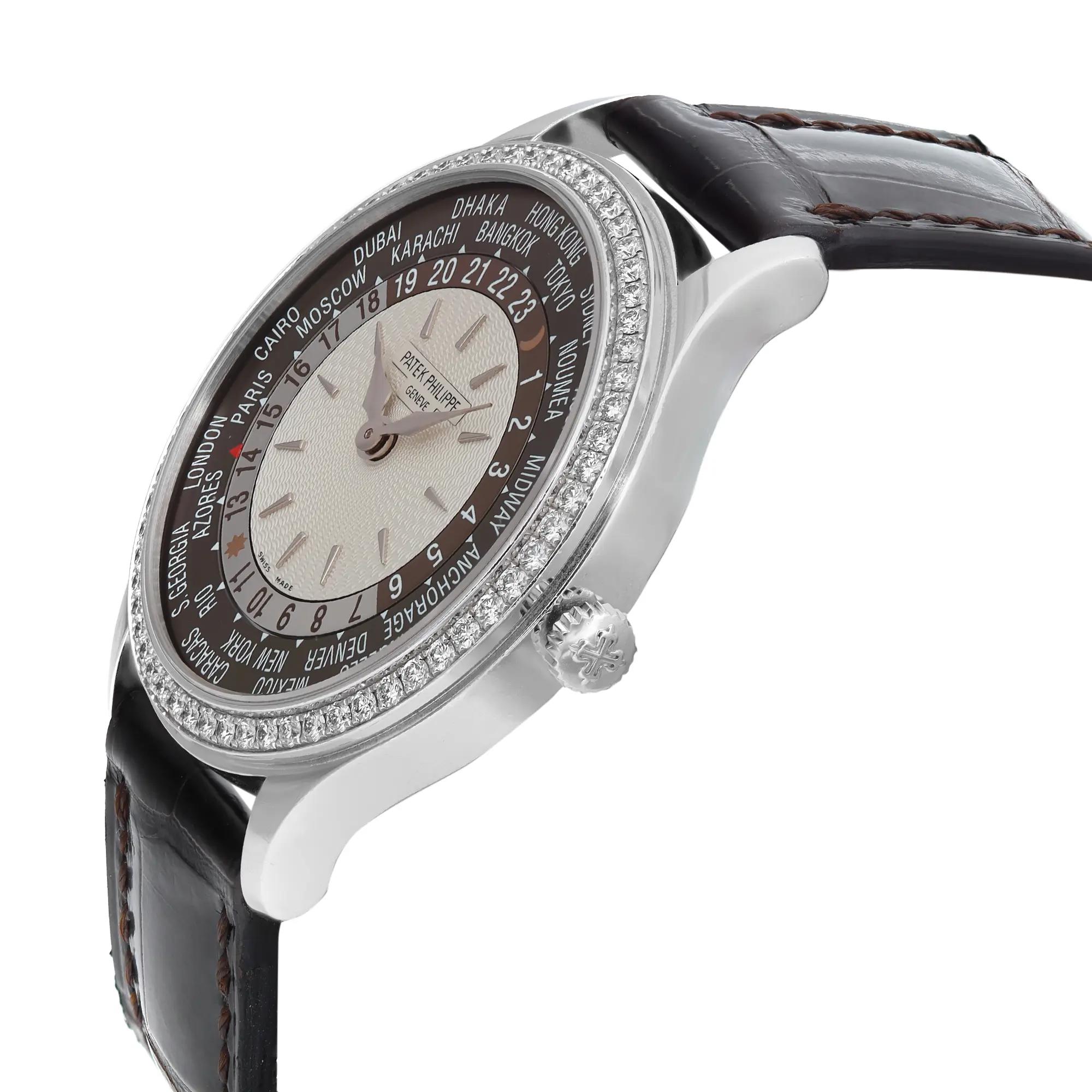 An image of a pre-owned wristwatch viewed from a side profile angle, highlighting the crown. The watch features a round face with a detailed city ring and a diamond-encrusted bezel. The leather strap is visible, showcasing its stitching and texture. The image is taken at a close distance, focusing on the elegant design and craftsmanship of the timepiece.