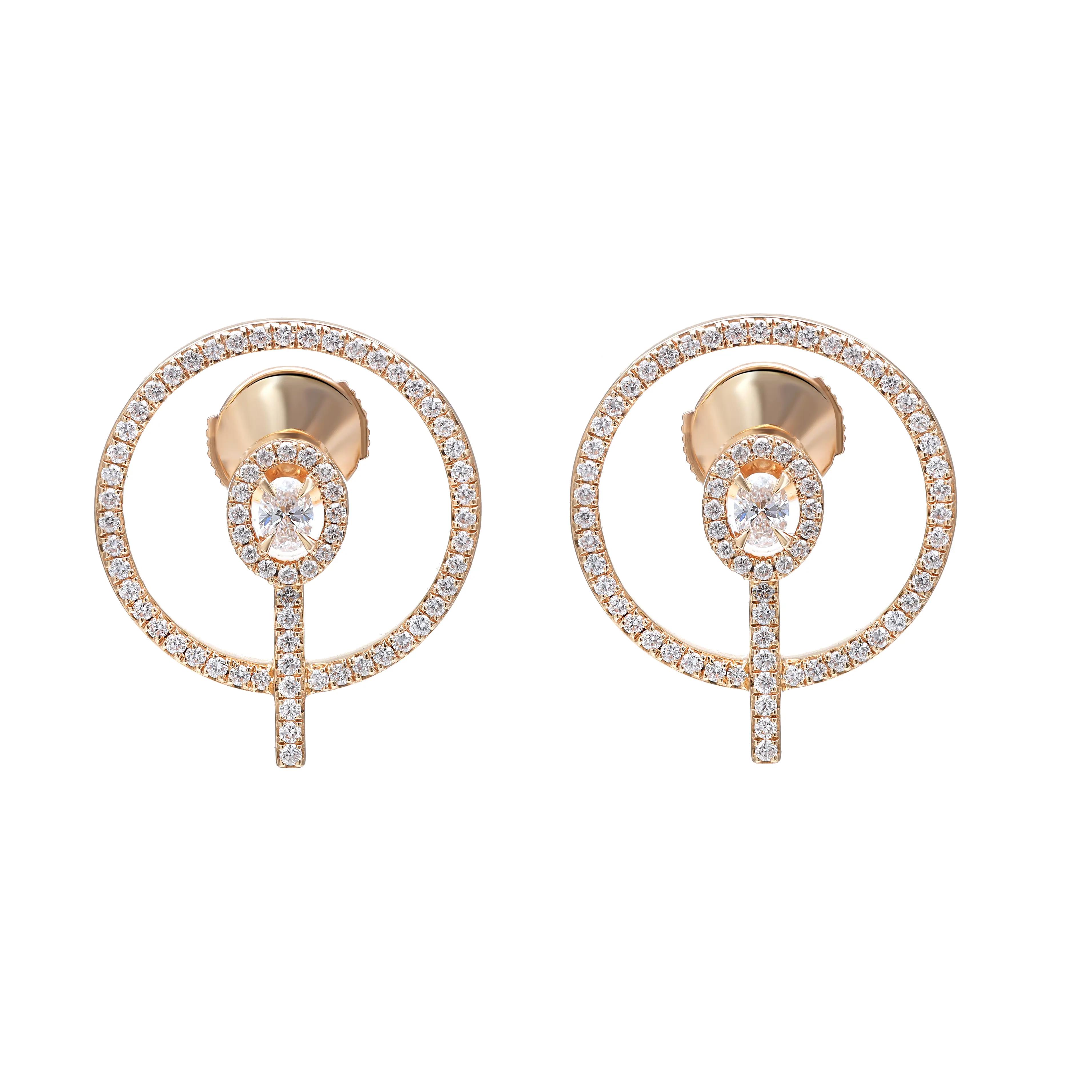 An image of a pair of women's Messika brand Glam'Azone stud 18k yellow gold earrings with diamonds, presented against a white background. The earrings feature a circular design with a central diamond, surrounded by smaller diamonds set in a halo pattern. The circles are attached to a diamond-encrusted bar that acts as the drop element of the earring. The earrings are positioned symmetrically, facing forward, with a medium-close perspective that provides a clear view of the intricate details and the reflective quality of the gold and diamonds.