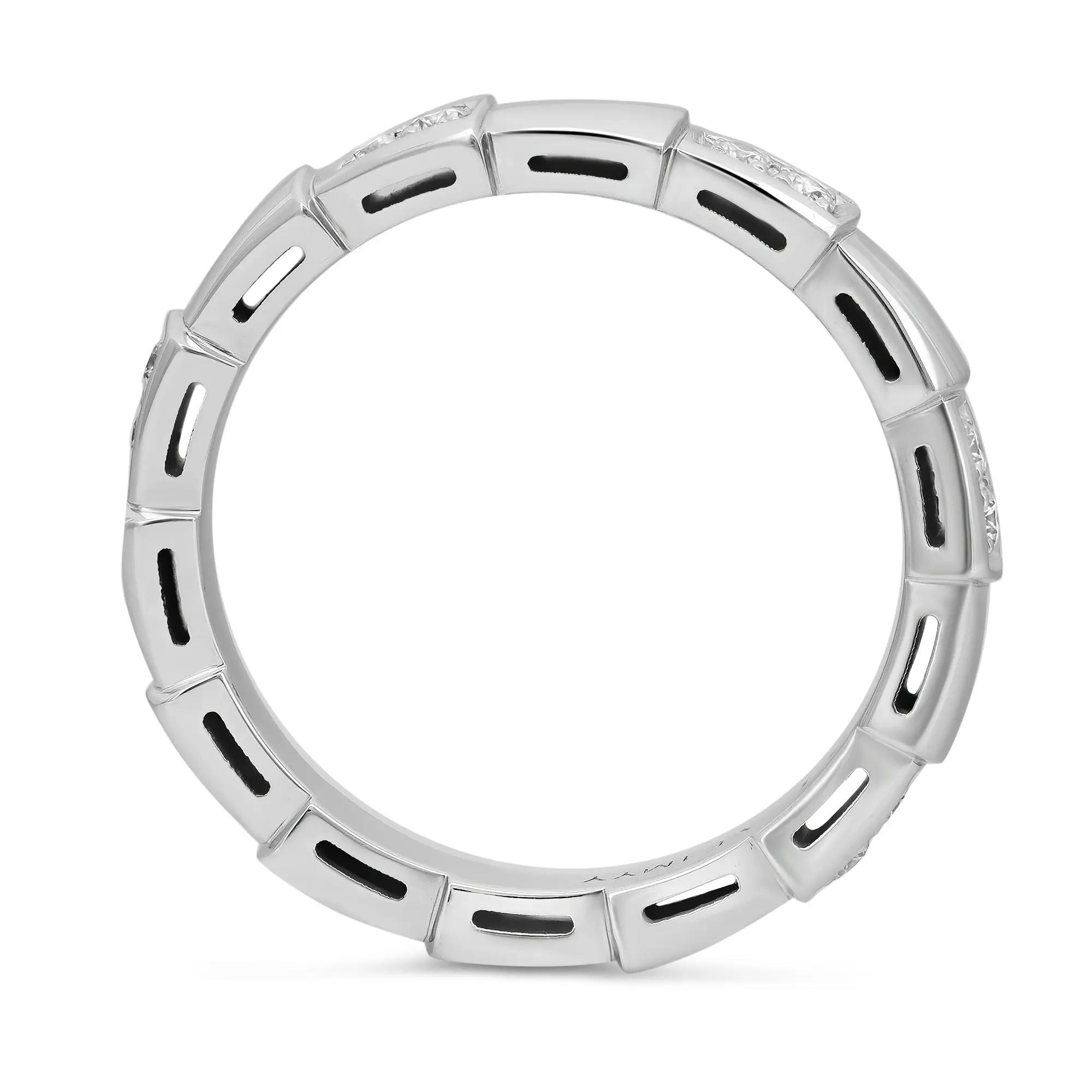 An image of a unisex adult Bvlgari Serpenti Viper band ring with diamonds, shown in a head-on view. The ring is centered and occupies most of the image, set against a white background. It features a circular band with a series of evenly spaced, rectangular cut-outs, each bordered by polished white gold and accented with a diamond at the top. The craftsmanship of the ring reflects a sleek and modern design. The condition of the ring is new. 