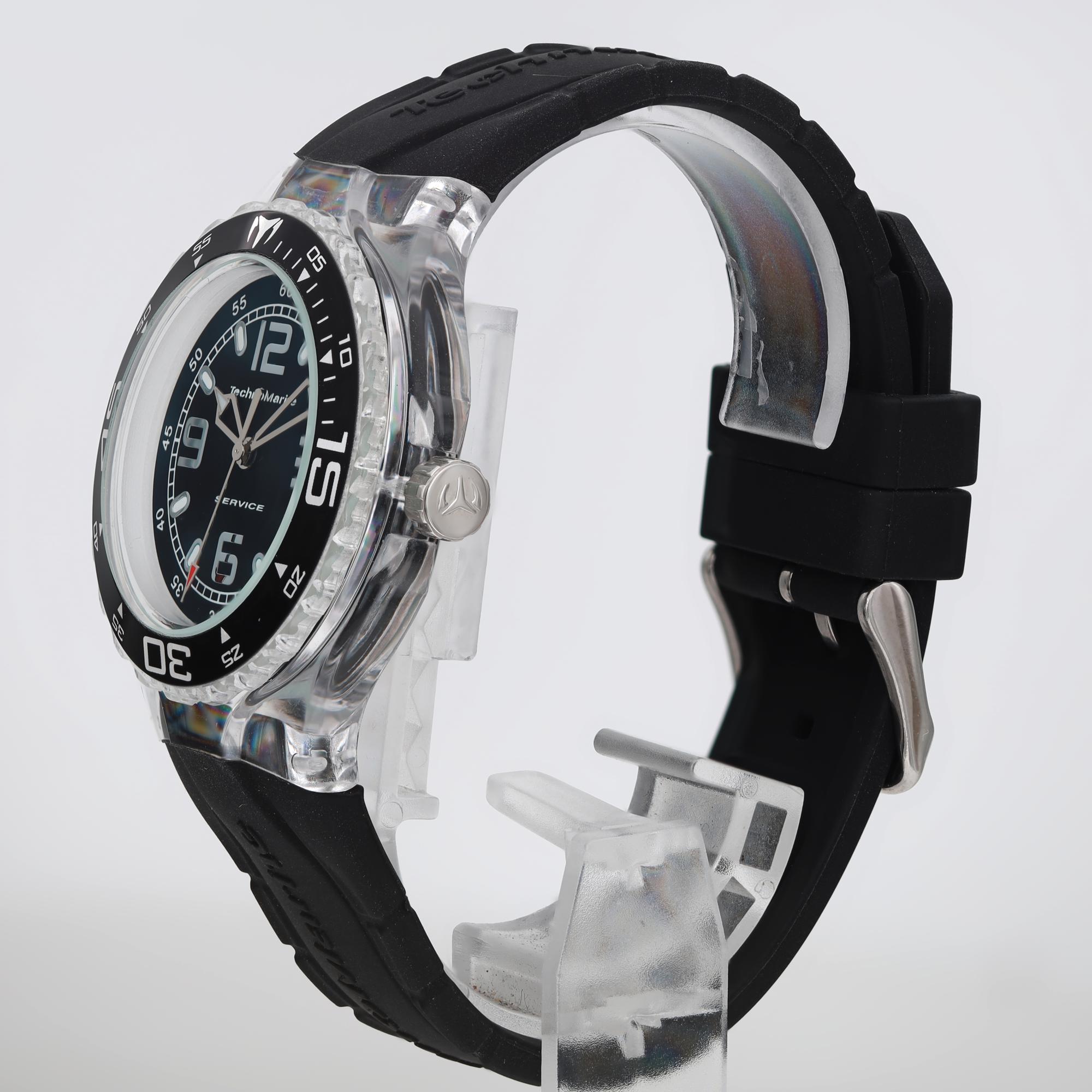An image of a Wristwatch by TechnoMarine. This Pre Owned item is designed for Women, featuring a Casual style. It has a Quartz movement and an Analog display with a Black dial color. The indices include 12-Hour Dial,Arabic Numerals,Stick Indexes. The band is made of Silicone and the case is made of Plastic. The watch has a Round shape with a case size of 40 mm and a case thickness of 11.5 mm.