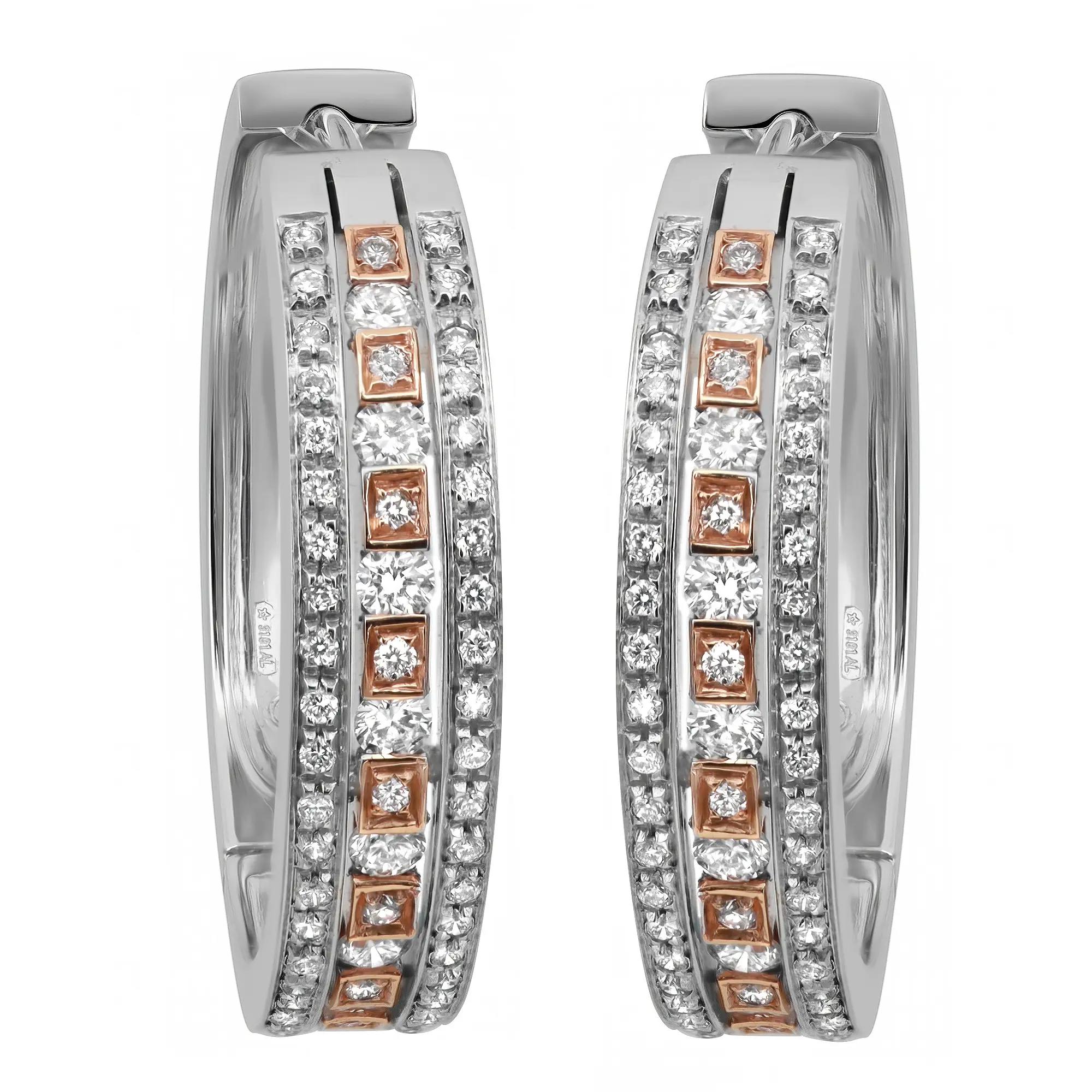 An image of a pair of women's Damiani earrings adorned with diamonds. The earrings are positioned vertically and are shown from a front-facing angle, allowing a close-up view of the intricate design in white gold. Each earring features two rows of small, round diamonds set in white gold, with a central line of square diamond settings bordered by rose gold, providing a contrasting accent. The image captures the luxurious detail and craftsmanship of the jewelry.