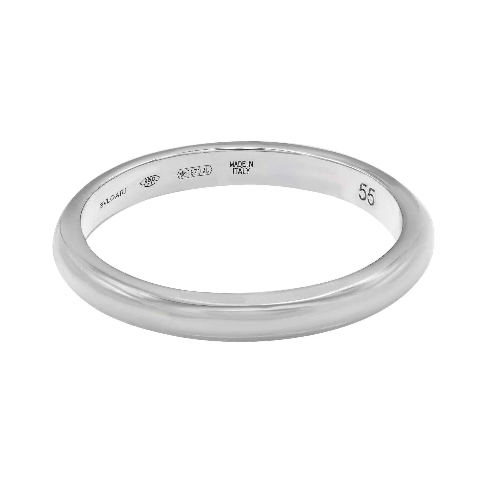 An image of a Bvlgari Fedi unisex adult platinum wedding ring without stones, centered and displayed at a slight angle to showcase the band's exterior and interior engravings. The ring is positioned against a white background, with the focus on clarity and detail from a close-up distance. The inner band is visibly engraved with the brand name, purity marks, 'MADE IN ITALY', and a serial number.Excellent pre-owned condition.