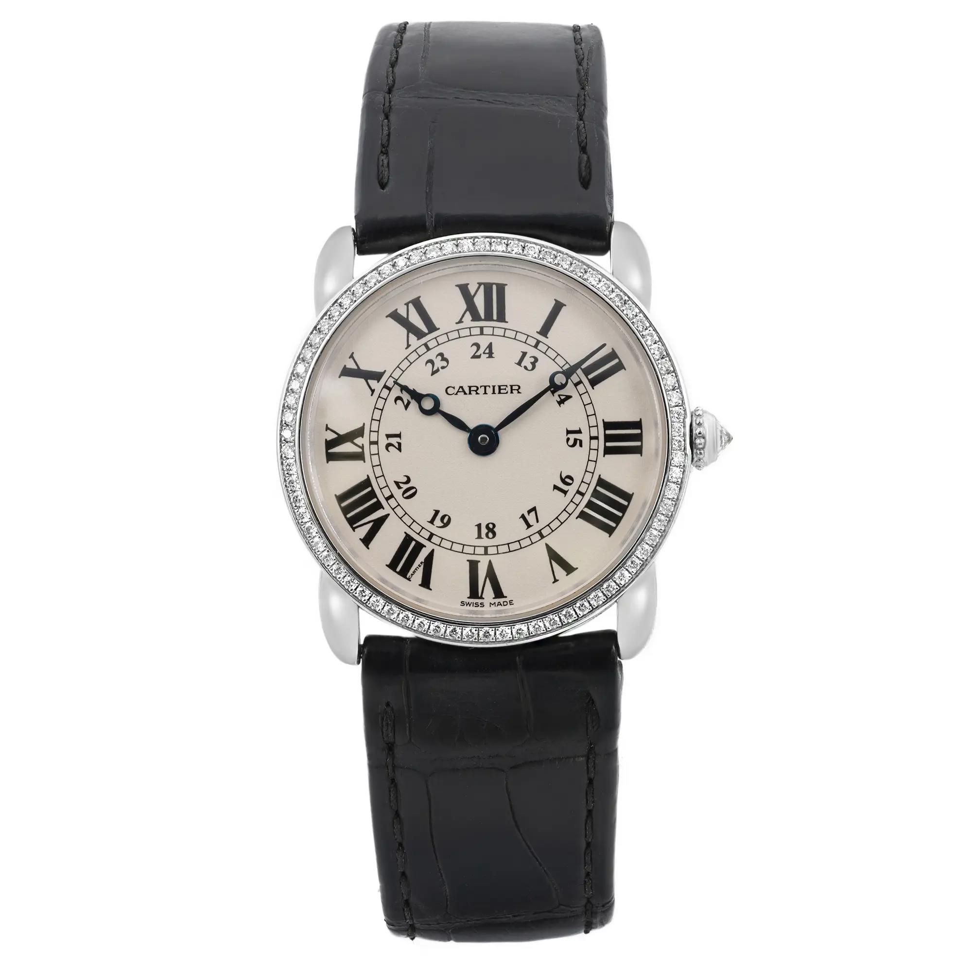 An image of a pre-owned wristwatch taken from a front full frontal view. The watch features a classic round face with Roman numerals and a black leather strap. The silver bezel is adorned with small diamonds, and the watch hands are elegantly designed. The image is captured at close range, highlighting the intricate details of the watch face and strap.