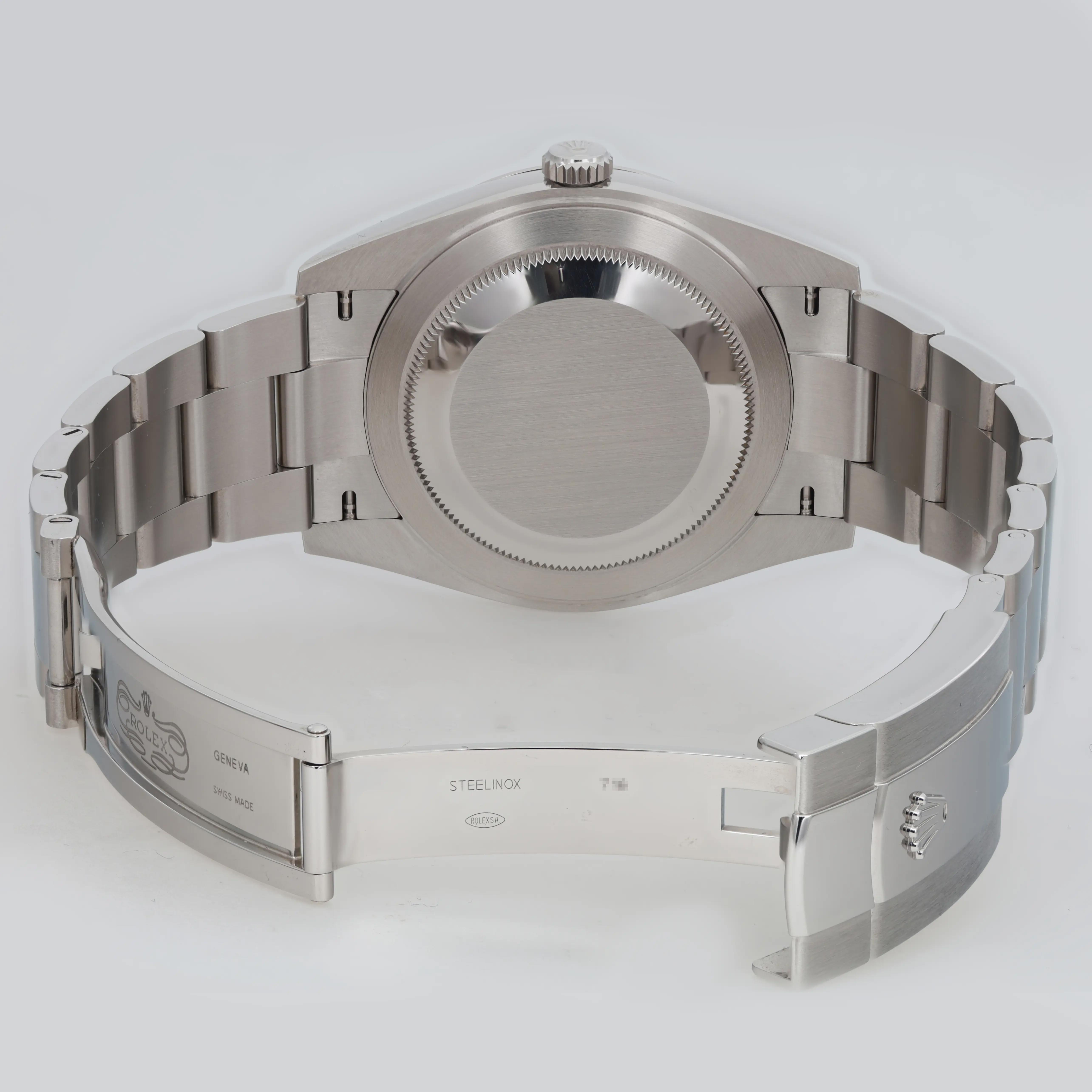 Back View Of Solid Back Case And Open Stainless Steel Band Of Rolex 126300 Watch Pre Owned Condition